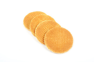 Dutch waffle called a stroopwafel isolated on a white background.
