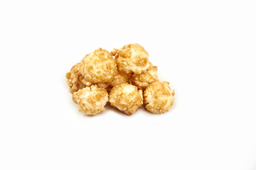 Pile of caramel popcorn on white background.