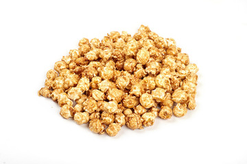 Pile of caramel popcorn on white background.