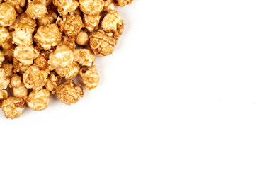Pile of caramel popcorn on white background.