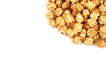 Pile of caramel popcorn on white background.