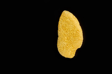 fried chicken breast on black background, photo in studio
