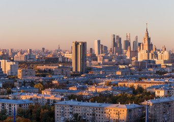 Obraz premium Moscow, Russia, view of the business center, Moscow University, and old houses, at sunset, autumn