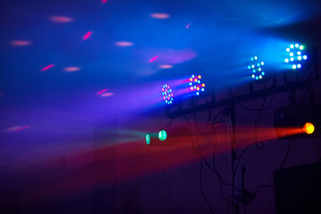 Stage lights in action at the concert. Lights show. Lazer show. Night club dj party people enjoy of...