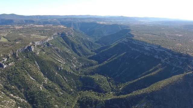 Flying above a large erosional landform the cirque de Navacelles in France. Aerial horizontal view