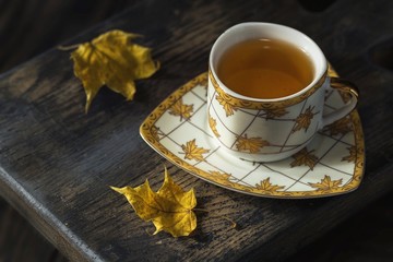 cup of tea and flowers on table