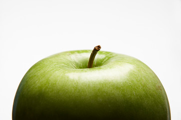 FRESH GREEN APPLE ON WHITE BACKGROUND