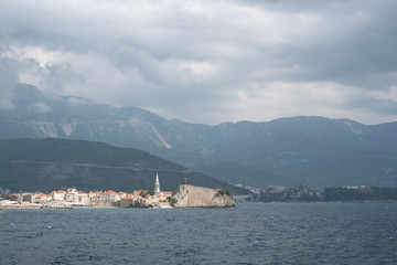 Fototapeta na wymiar Budva. The old Town. Cloudy sky over houses Adriatic Sea. Montenegro. Europe.