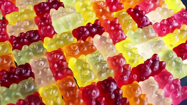 Gummy bear background. Gummy bears as texture. Gum bear candy colorful pattern.