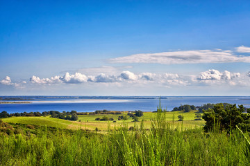 Fototapeta na wymiar Landscape and Baltic Sea with clouds on the island Hiddensee. Panorama of Hiddensee.