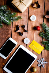 smartphone, tablet, shopping for new year online wooden table