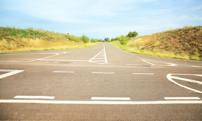 Empty asphalt crossroad in countryside