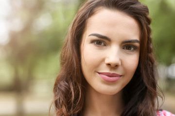 Portrait of beautiful young woman outdoors