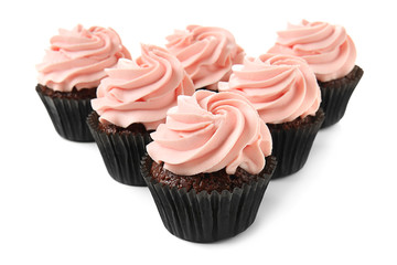 Delicious cupcakes on white background