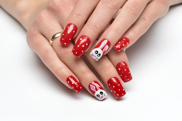 New Year's red manicure with hares and white dots, snow on long square nails on a white background close-up   © dina_shuba