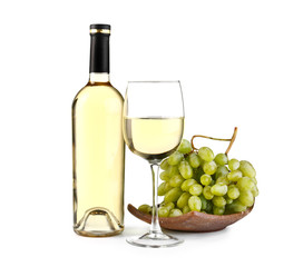 Composition with tasty wine and fresh grapes on white background