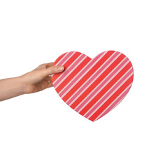 Woman holding heart shaped gift box on white background