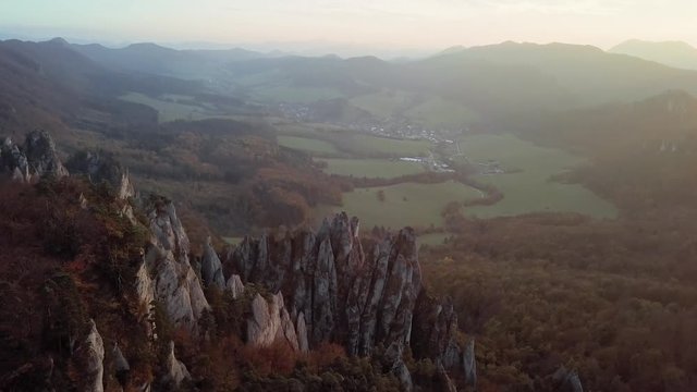 Aerial view of Sulov Rocks formation (Sulovske skaly) over autumn forest at sunset. Near Zilina, Slovakia