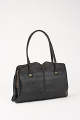 BLACK WOMENS CROCODILE SKIN HANDBAG ISOLATED ON WHITE BACKGROUN