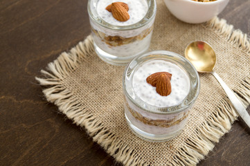 Fototapeta na wymiar Useful homemade yogurt with nuts and muesli.