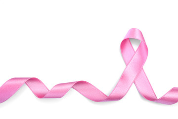 Curled pink ribbon on white background. Breast cancer concept