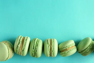Gordijnen Fresh tasty macaroons on color background © Pixel-Shot