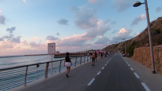 Bicycle ride in Tel Aviv shoreline at sunset