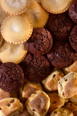 SELECTION OF BUNS CAKES PASTRIES AND DOUGHNUTS IN BAKERY