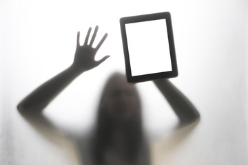 Shadow hands of the woman behind the white curtain