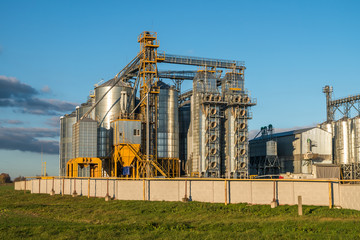 silver silos on agro-processing plant for processing and storage of agricultural products, flour, cereals and grain © hiv360