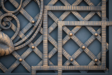 wrought-iron gates, ornamental forging, forged elements close-up