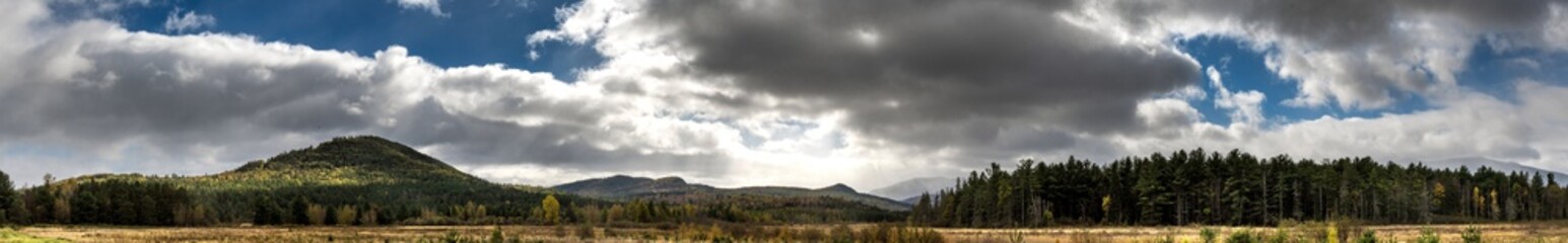 Naklejka na ściany i meble Panoramic view of a late fall mountains scene with spectacular sky near Lake Placid NY