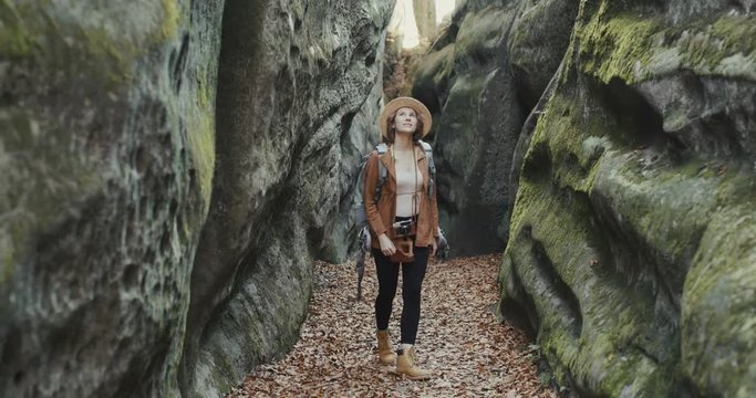 girl looks around in the forest