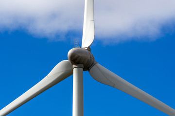 Wind turbine close up with blue sky and clouds in Quebec © Guy