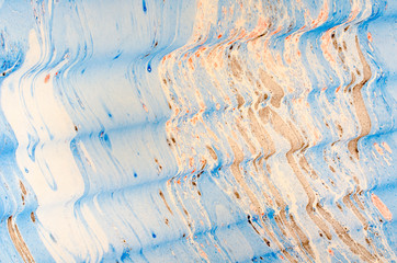 Abstract background for text or image. Ebru technique. Modern art. Marbled paper. Marbleized effect. Marble paper texture. Blue and orange.