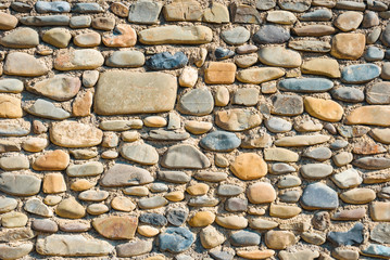 Ancient wall from big round stones