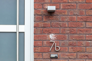 House number seven B 7B in curved and twisted metal - stainless steel, in designer font from Sweden