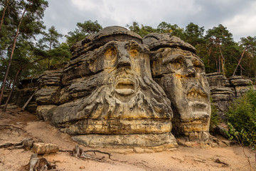 Fototapeta na wymiar Zelizy, Czech Republic - September 9, 2018: One of the Devil Heads, rock sculptures created by Vaclav Levy