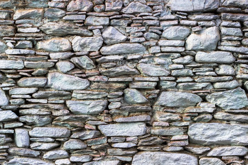 Front shoot of masonry blue tonnes stone wall as texture sample