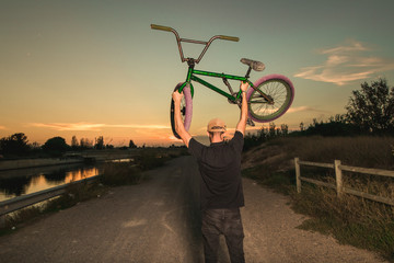 Portrait of a young man with a bmx bicycle