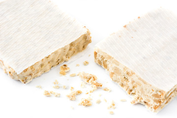 Typical christmas almond nougat isolated on white background