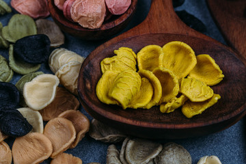 Traditional Italian Rainbow pasta. Colored raw pasta on a stone background