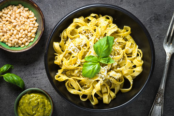 Tagliatelle pasta with pesto sauce and parmesan.