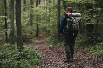 Fototapeta na wymiar Young hiker in nature / wilderness - trekking outdoors.