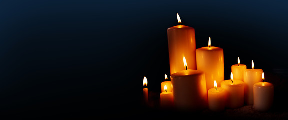 Burning candles in the dark night