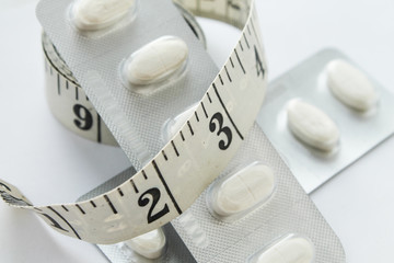 Diet pills on white background