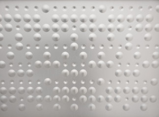 Braille like pattern in a metal surface
