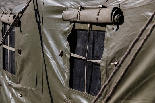 The window of an army military tent is shot close up.