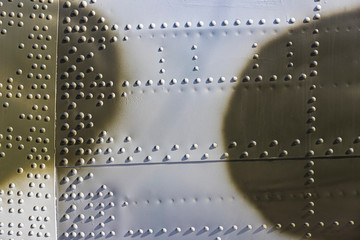The texture of the metal of military equipment close-up shot. 