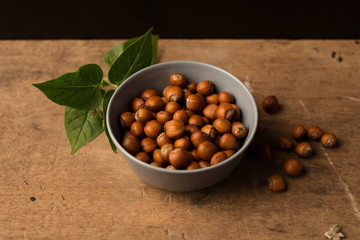 hazelnuts with wood background